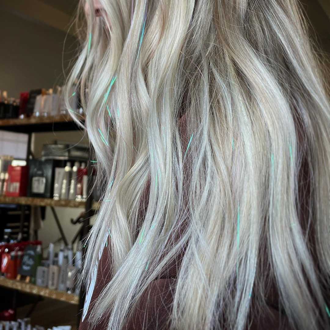 add shiny tinsel to your hair to create an eye-catching look