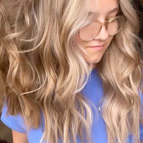 restored damaged hair from well-water and added highlights to create healthy vibrant hair