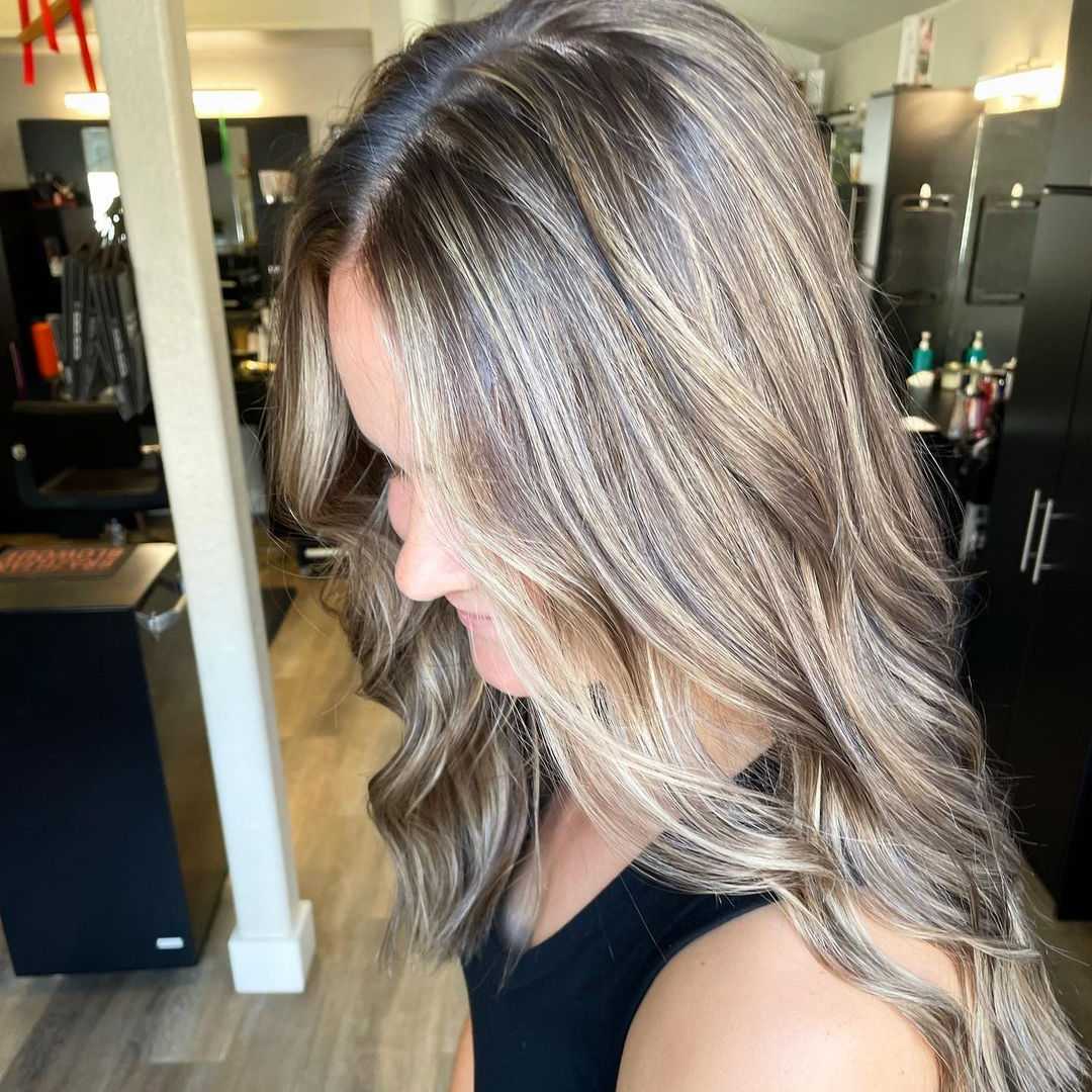 soft blonde highlights to brunette hair creates a fresh, summer look